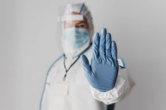 front-view-doctor-doing-the-stop-sign