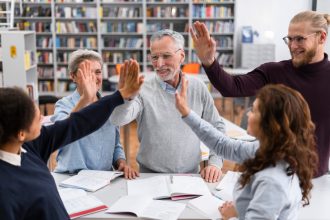 people-high-five-library-close-up